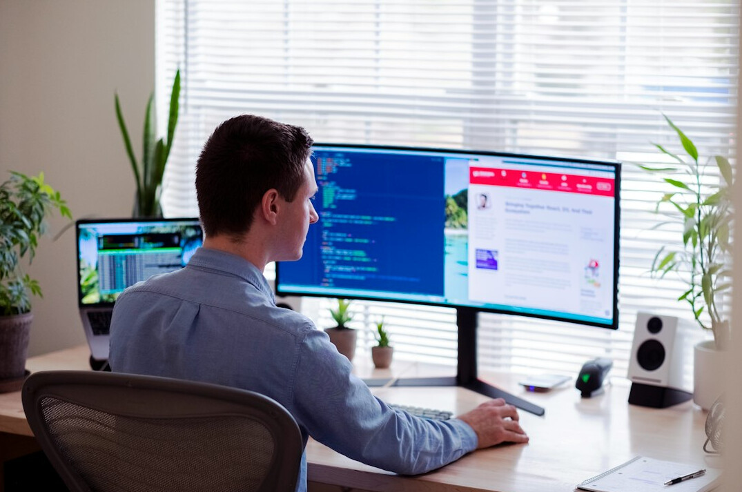 programmer coding at desk